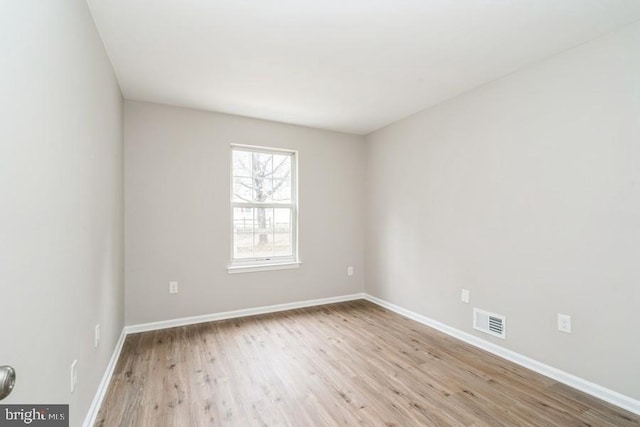 unfurnished room with light hardwood / wood-style floors