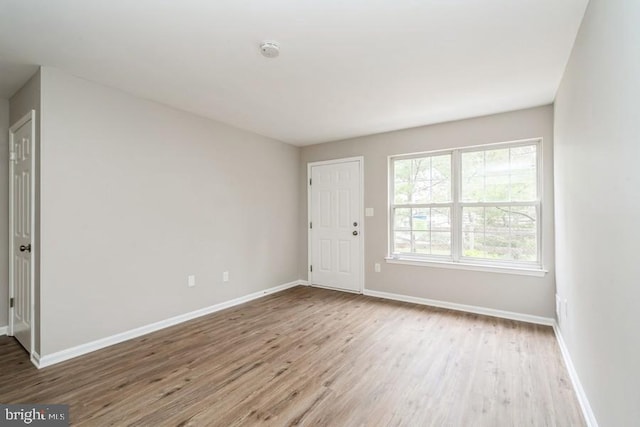 spare room with light hardwood / wood-style floors