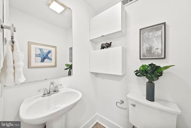 bathroom with sink and toilet