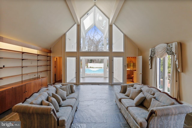 living room with high vaulted ceiling