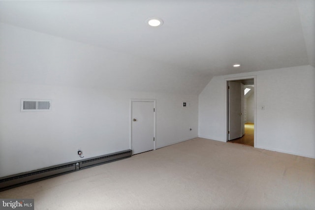 bonus room with light colored carpet, vaulted ceiling, and a baseboard radiator