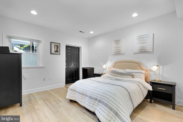 bedroom featuring light hardwood / wood-style flooring