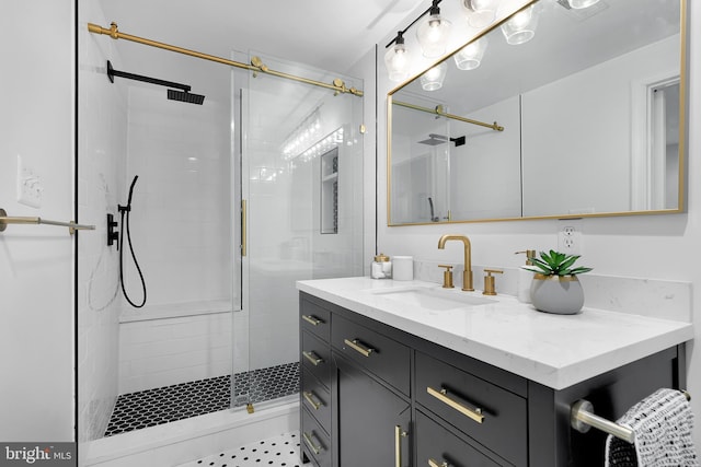 bathroom featuring vanity and an enclosed shower