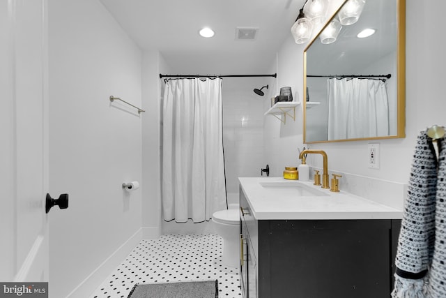 full bathroom featuring vanity, toilet, and shower / tub combo