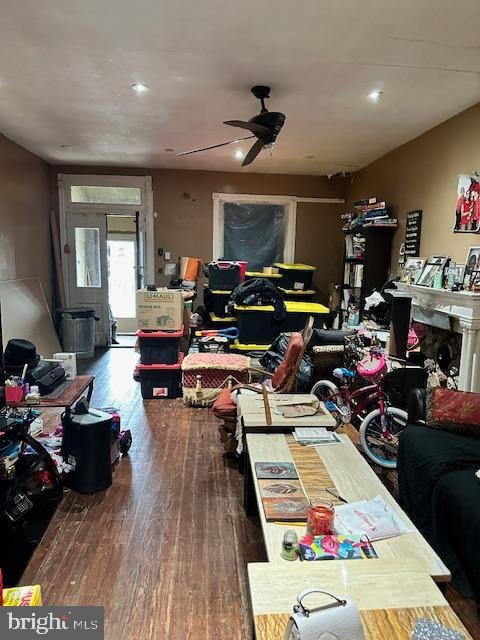 home office with hardwood / wood-style floors and ceiling fan