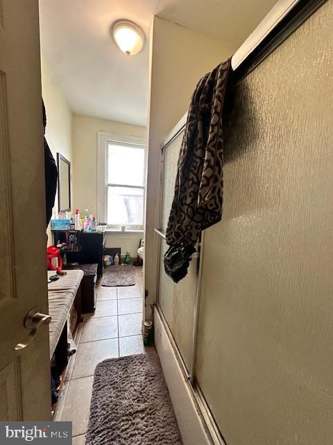 mudroom with light tile floors