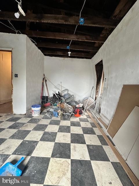 basement featuring tile flooring