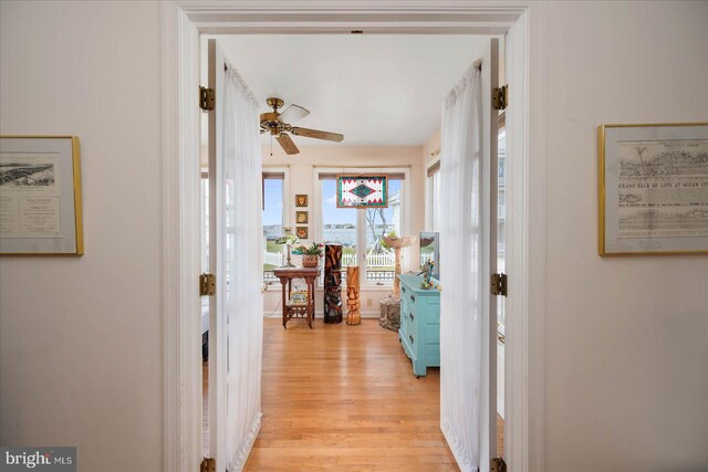 hall with light hardwood / wood-style floors