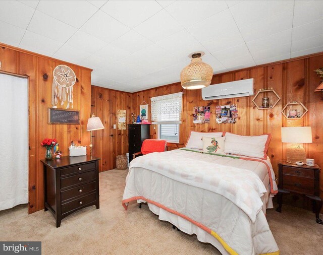 carpeted bedroom featuring wood walls and a wall mounted air conditioner