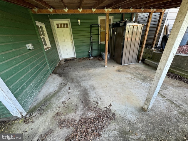 view of patio with a shed