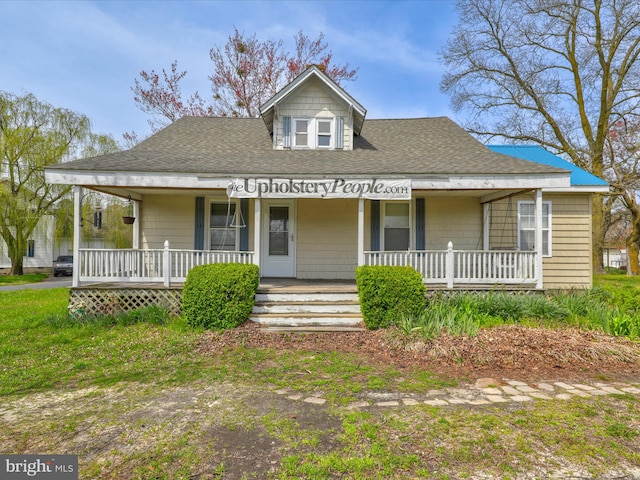 country-style home featuring covered porch