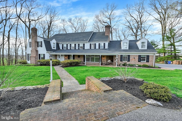 view of front of home featuring a porch and a front lawn