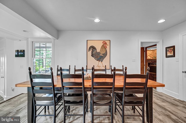 dining space featuring wood-type flooring