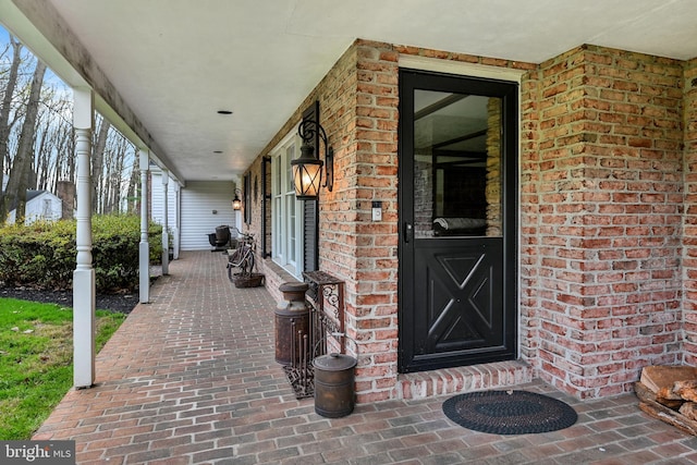 entrance to property featuring a porch