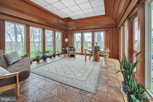 sunroom / solarium with ceiling fan