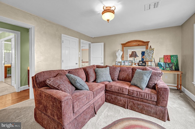 living room featuring light carpet