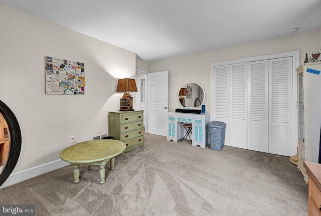 sitting room featuring carpet flooring