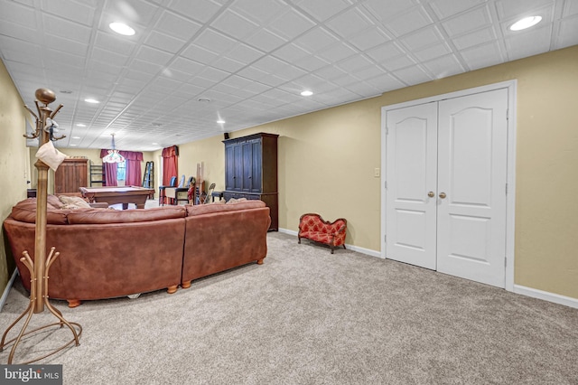 carpeted living room featuring pool table