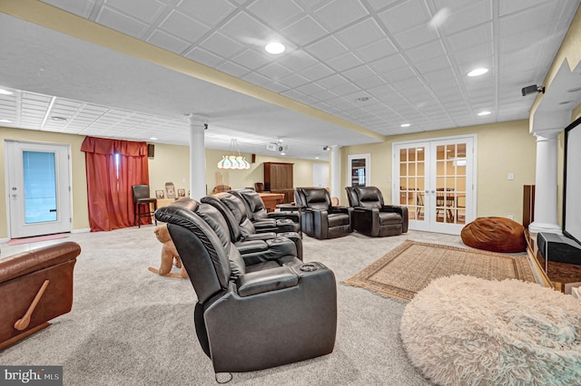 living room featuring french doors, carpet flooring, and decorative columns