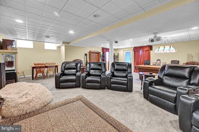 cinema room featuring ornate columns and carpet