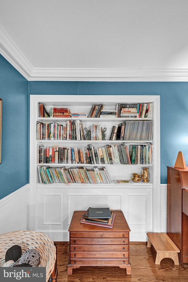 sitting room featuring crown molding and hardwood / wood-style floors