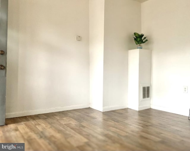 empty room featuring dark hardwood / wood-style floors