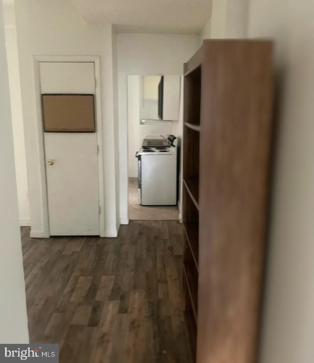 hallway featuring dark wood-type flooring