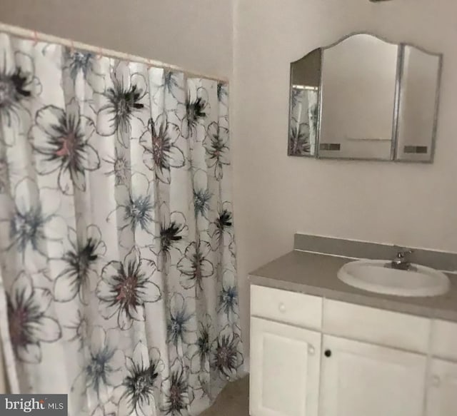 bathroom featuring vanity with extensive cabinet space