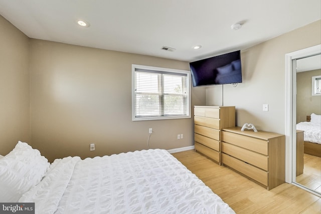 bedroom with light hardwood / wood-style flooring