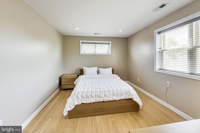 bedroom with light hardwood / wood-style flooring