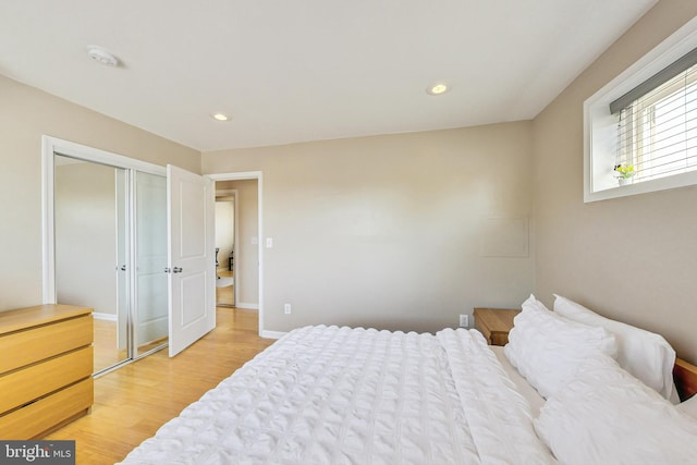 bedroom with a closet and light wood-type flooring