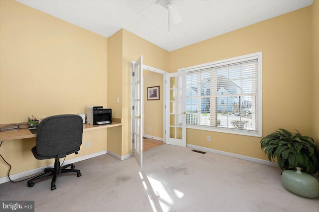 office area featuring light colored carpet and ceiling fan