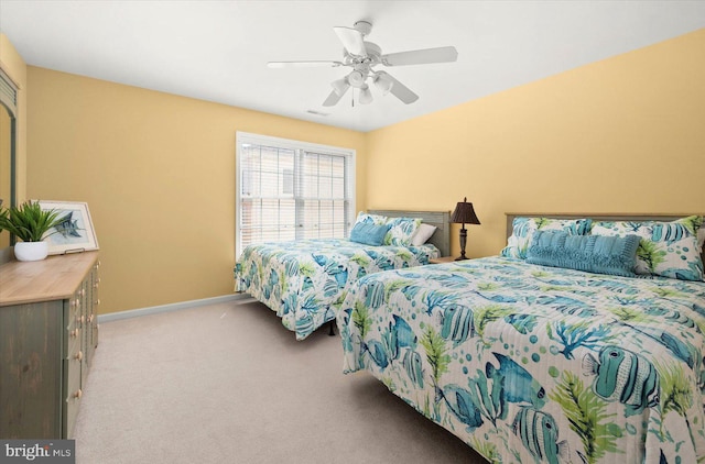 bedroom with light colored carpet and ceiling fan