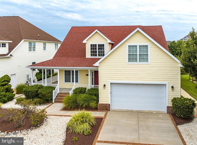 view of front of home featuring a garage and a porch