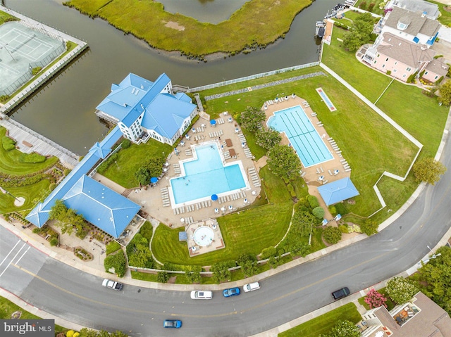 birds eye view of property featuring a water view