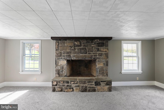 carpeted living room with a fireplace