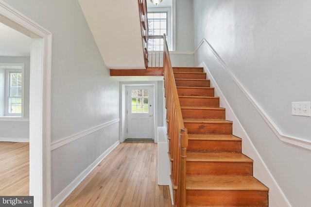 stairway featuring light hardwood / wood-style floors