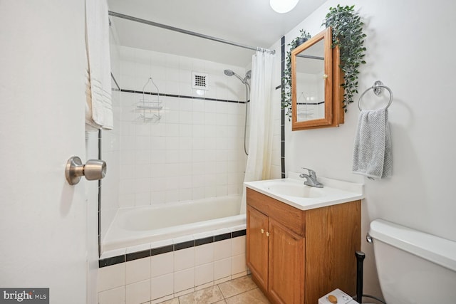 full bathroom featuring tile floors, shower / bath combination with curtain, large vanity, and toilet