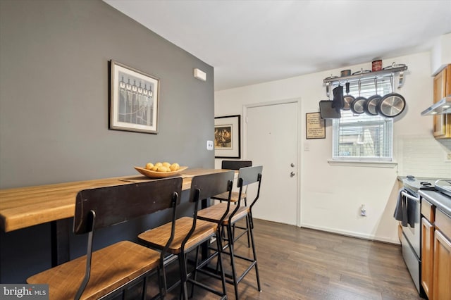 dining space featuring dark hardwood / wood-style flooring