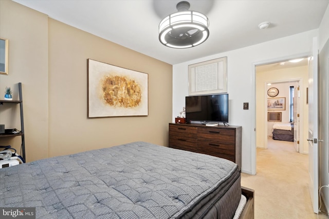 bedroom featuring light colored carpet