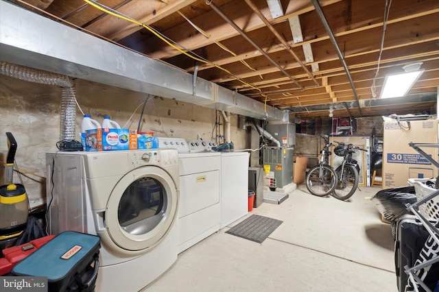 basement featuring heating utilities and separate washer and dryer