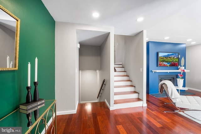 stairway featuring hardwood / wood-style flooring