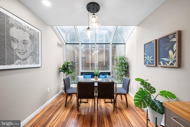 dining space featuring hardwood / wood-style floors