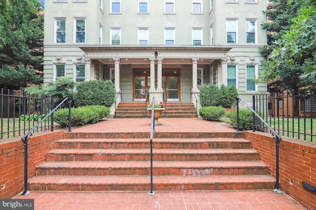 view of exterior entry featuring a porch