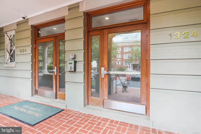 view of exterior entry featuring french doors