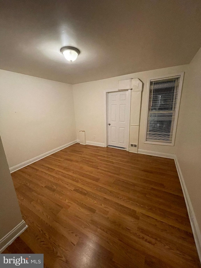 empty room featuring dark hardwood / wood-style floors