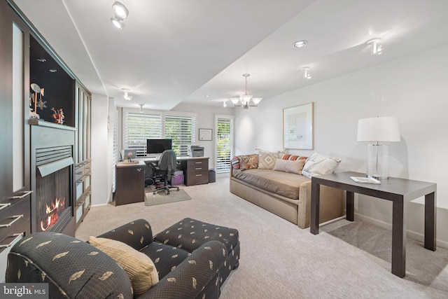 living room with light carpet and an inviting chandelier