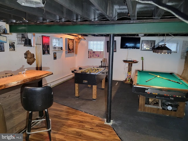 playroom with wood-type flooring, a baseboard radiator, and billiards