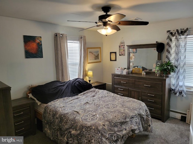 bedroom with carpet, ceiling fan, and a baseboard radiator