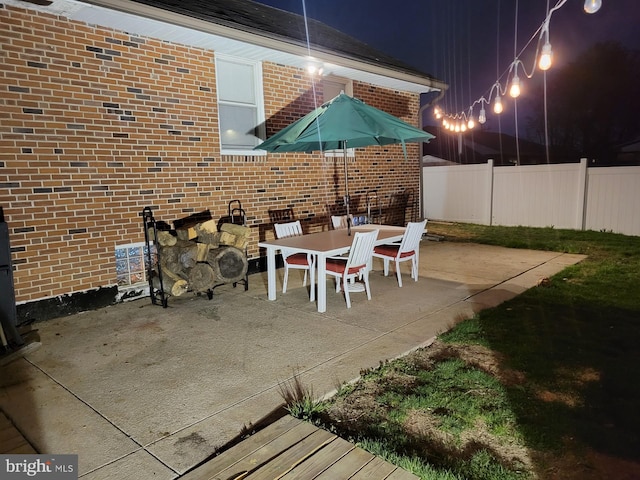 view of patio terrace at night